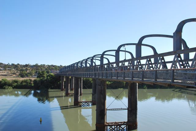 The historic iron Murray Bridge road bridge spanning the River Murray on a clear day.