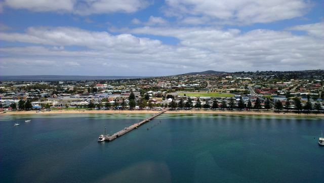 Port Lincoln's town jetty, beachfront and town seen from above Boston Bay.